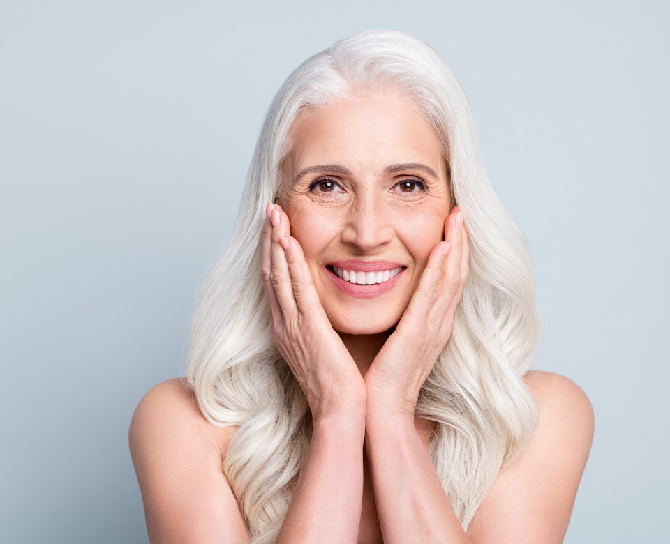 Close Up Portrait Of Her She Nice Attractive Cheerful Grey Haired Elderly Lady Touching Silky Skin Cleansing Isolated On Gray Pastel Color Background