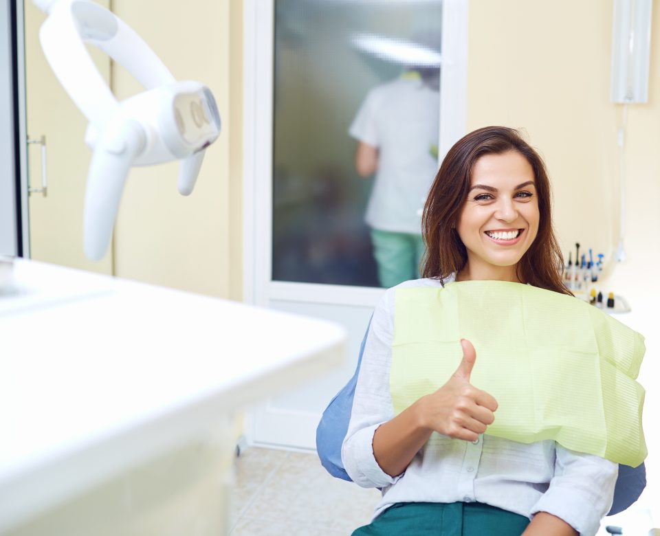 Patient Woman Smiling At The Dental Clinic.